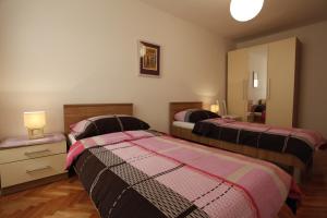 Posteľ alebo postele v izbe v ubytovaní Apartment Vallamar free parking
