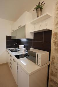 Kuchyňa alebo kuchynka v ubytovaní Apartment Vallamar free parking