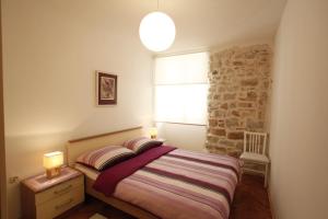 Posteľ alebo postele v izbe v ubytovaní Apartment Vallamar free parking