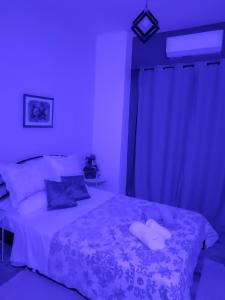 Ένα ή περισσότερα κρεβάτια σε δωμάτιο στο Blue Dreams +8 φωτογραφίες