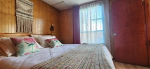 Postel nebo postele na pokoji v ubytování Hostal Castro Chiloé - Chacabuco #279