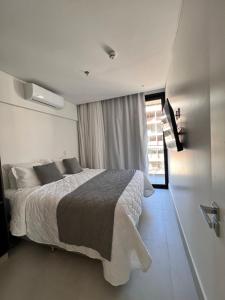 a bedroom with a large bed and a window at Meu Resort Porto Alto in Cupe +30 photos