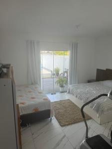 Postel nebo postele na pokoji v ubytování Casa em Guaratuba com piscina + 9 fotografií