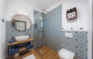a bathroom with a shower and a mirror at Villa Bartolo in Labin