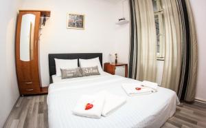 Posteľ alebo postele v izbe v ubytovaní Rooms Eliza + 27 fotografií