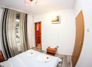Posteľ alebo postele v izbe v ubytovaní Rooms Eliza