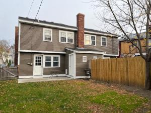 a house with a fence in front of it at Sherizee Home in Marblehead