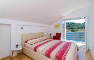 Postel nebo postele na pokoji v ubytování Two-Bedroom Holiday Home In Opuzen