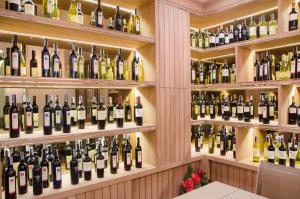 a wall of bottles of wine in a wine cellar at The Erawan Koh Chang -SHA Extra Plus in Ko Chang