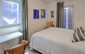 2 Bedroom Gorgeous Apartment In Olib客房内的一张或多张床位