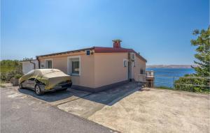 a small house with a car parked in front of it at Cozy Apartment In Baric Draga in Barić Draga +15 photos