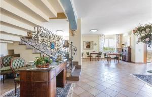a living room with a staircase and a dining room at 3 Bedroom Lovely Home In Agropoli Sa in Ogliastro Cilento