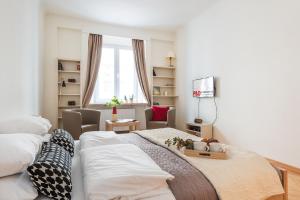 Posteľ alebo postele v izbe v ubytovaní P&O Podwale Apartments
