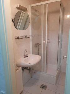 a bathroom with a sink and a shower at Apartment in Zamardi - Balaton 53130 in Zamárdi