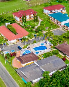 an overhead view of a resort with a pool at Hotel La Aldea Pijao in Montenegro +23 photos