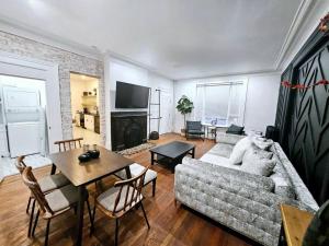 a living room with a couch and a table at Downtown Adams in Sandusky