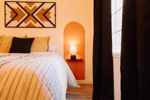 a bedroom with a bed and a lamp and a window at Desert Watercolor Part 2 in Virgin