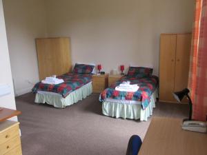 
A bed or beds in a room at University Hall - Campus Accommodation
