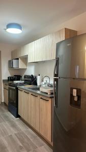 Kuchyň nebo kuchyňský kout v ubytování Distrito Artemisa Loft Apartments