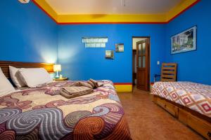 Una cama o camas en una habitación de Casa Juarez B&B