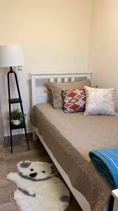 Postel nebo postele na pokoji v ubytování Distrito Artemisa Loft Apartments