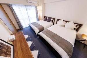 Ένα ή περισσότερα κρεβάτια σε δωμάτιο στο Shippo Town Hotel Nishiohashi-eki