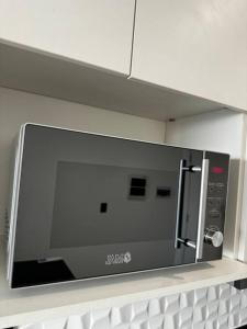 TV a/nebo společenská místnost v ubytování Molas, piso 12, piscina y cine