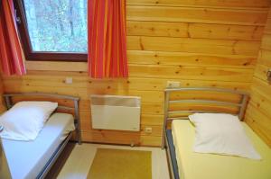 Postel nebo postele na pokoji v ubytování Gite De Boshut