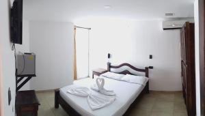 เตียงในห้องที่ Hotel Soliari Melgar
