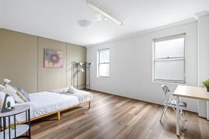 a bedroom with a bed and a table and chairs at Detached Double Room in Revesby - Tranquil Place - Shared Bathroom in Revesby +23 photos