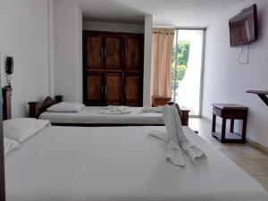 เตียงในห้องที่ Hotel Soliari Melgar