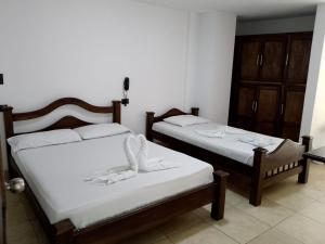เตียงในห้องที่ Hotel Soliari Melgar