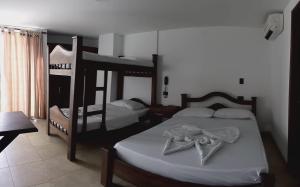 เตียงในห้องที่ Hotel Soliari Melgar