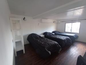 Ένα ή περισσότερα κρεβάτια σε δωμάτιο στο La Serena