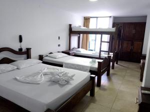 เตียงในห้องที่ Hotel Soliari Melgar