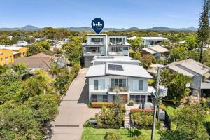 an aerial view of a house in a suburb at Beautiful Three-Story Villa footsteps to the Beach in Coolum Beach