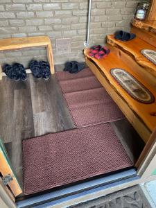 a row of mats on the floor of a room at Cabin - Hot tub - Fire pit - View - Getaway! in Oak Harbor +49 photos