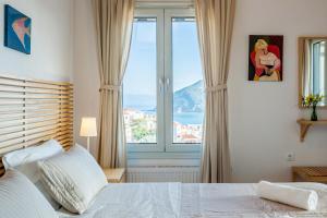 Postel nebo postele na pokoji v ubytování Thea Home Hotel by Booking Kottas
