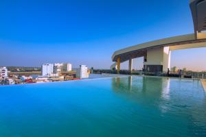 a swimming pool on the roof of a building at SUN & MOON, Urban Hotel in Phnom Penh