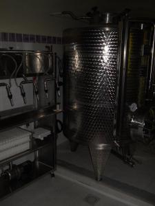 a kitchen with a large metal mixer in a room at Lo Scoiattolo in Ventimiglia