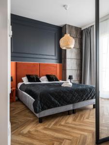 Posteľ alebo postele v izbe v ubytovaní Kasprzaka 29 By Perfect Apart Free Garage