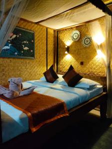 Postel nebo postele na pokoji v ubytování Yoschi's Hotel Bromo