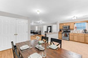a kitchen and dining room with a table and chairs at NYC & Downtown Newark Commuter Dream Stay in Newark