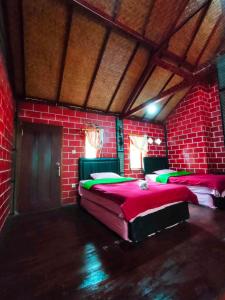 Letto o letti in una camera di Yoschi's Hotel Bromo
