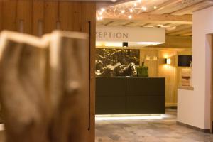 a view of a room with a reception in a building at Hotel Haflingerhof in Oberau