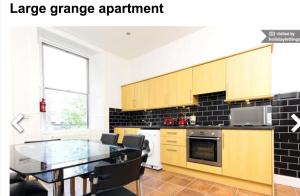 Кухня или кухненски бокс в Large Grange Apartment