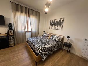 Ένα ή περισσότερα κρεβάτια σε δωμάτιο στο LuLi Rooms Napoli