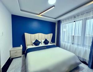 Postel nebo postele na pokoji v ubytování Anh Quan Khoi Hotel