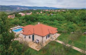 an aerial view of a house with an orange roof at 3 Bedroom Cozy Home In Grubine in Grubine