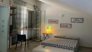 Postel nebo postele na pokoji v ubytování B&B dormirereggiocalabria